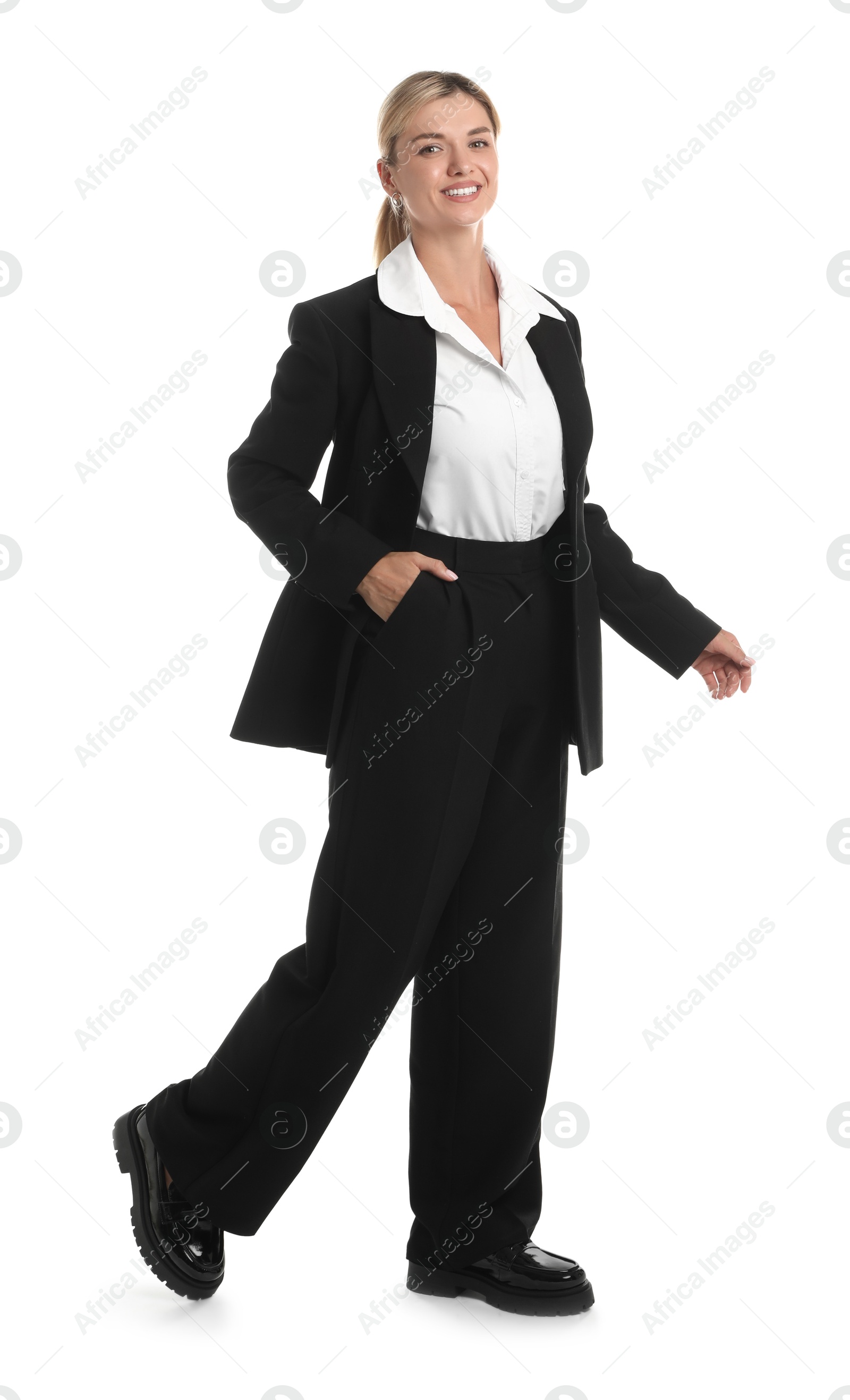 Photo of Beautiful woman in stylish black suit on white background