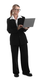 Beautiful woman in stylish black suit using laptop on white background