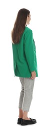 Young woman in stylish green jacket on white background, back view