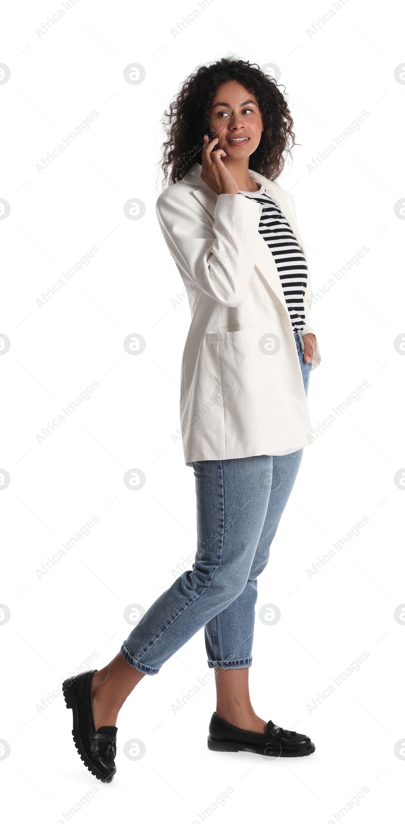 Photo of Beautiful woman in stylish jacket talking on smartphone against white background