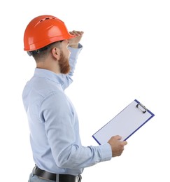 Engineer in hard hat with clipboard on white background