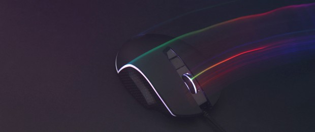 Computer mouse on dark background, space for text