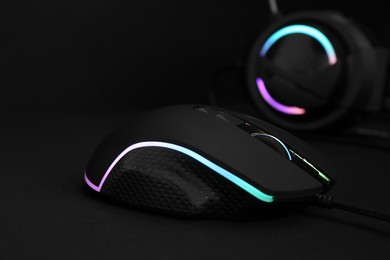 Photo of Computer mouse on black background, closeup view