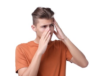 Young man suffering from sinusitis on white background