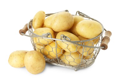 Photo of Young potatoes in metal basket isolated on white