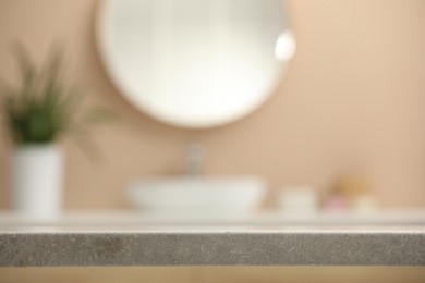 Photo of Blurred view of sink and mirror in bathroom