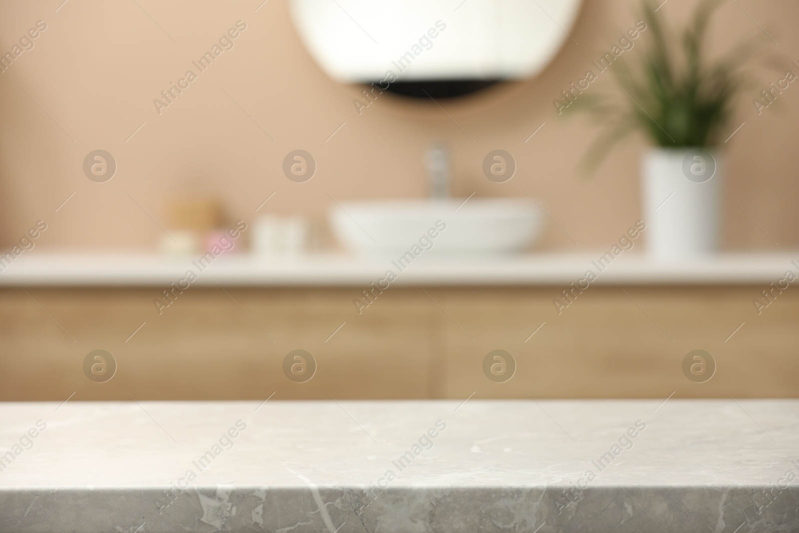 Photo of Blurred view of sink and mirror in bathroom