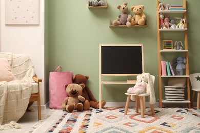 Stylish child room interior with different toys and furniture