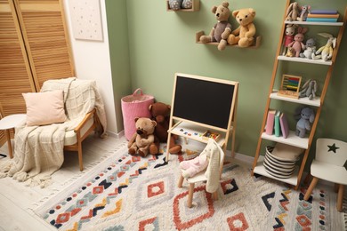 Stylish child room interior with different toys and furniture