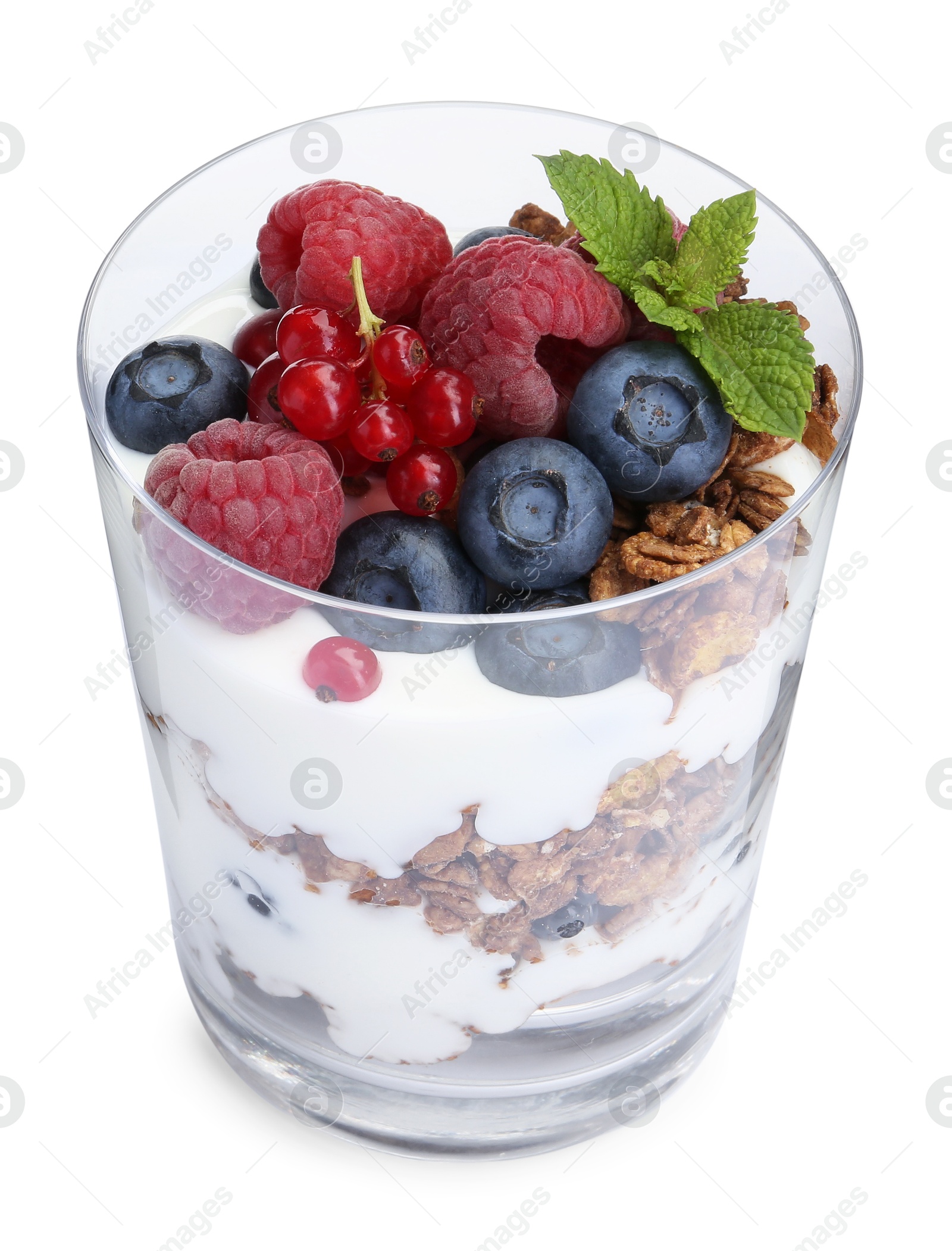 Photo of Tasty yogurt with fresh berries, granola and mint in glass isolated on white