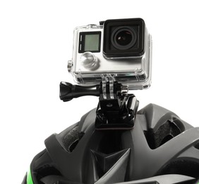 Photo of Modern action camera on helmet against white background