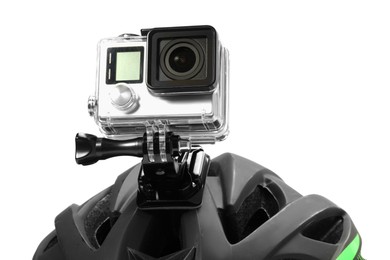 Photo of Modern action camera on helmet against white background