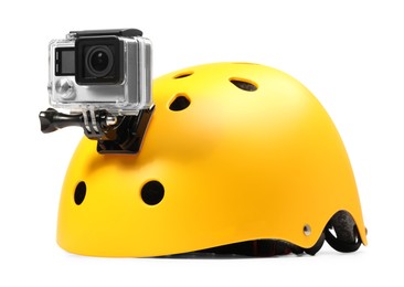 Modern action camera on helmet against white background