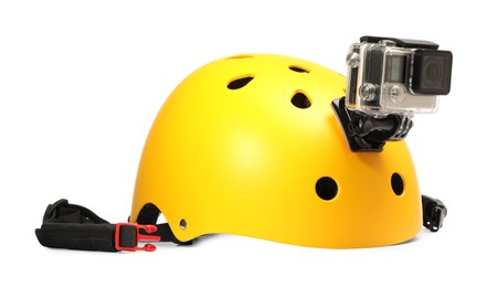 Modern action camera on helmet against white background