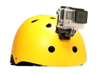 Modern action camera on helmet against white background