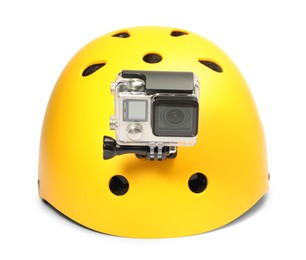 Modern action camera on helmet against white background