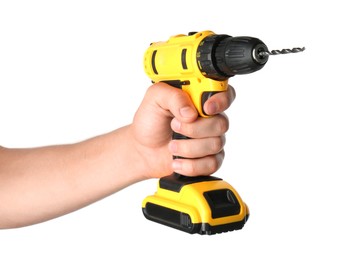 Photo of Man with cordless electric drill on white background, closeup