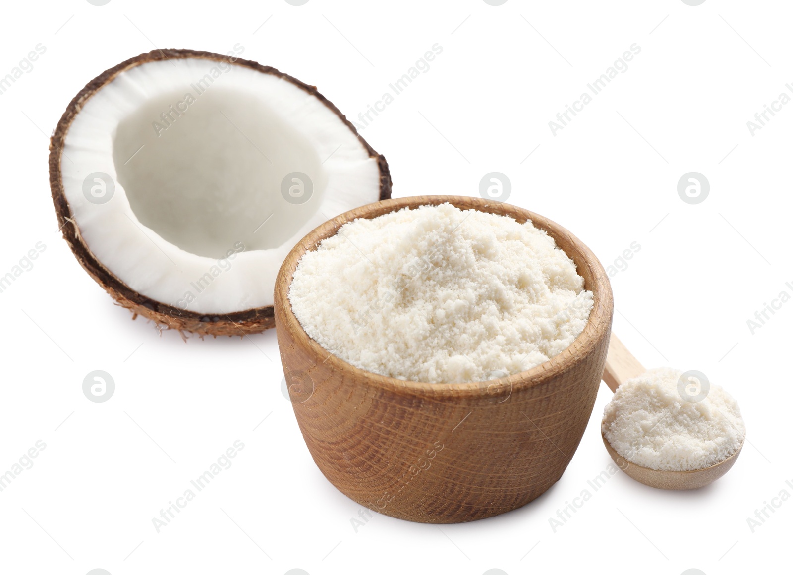 Photo of Fresh coconut flour in bowl, spoon and nut isolated on white