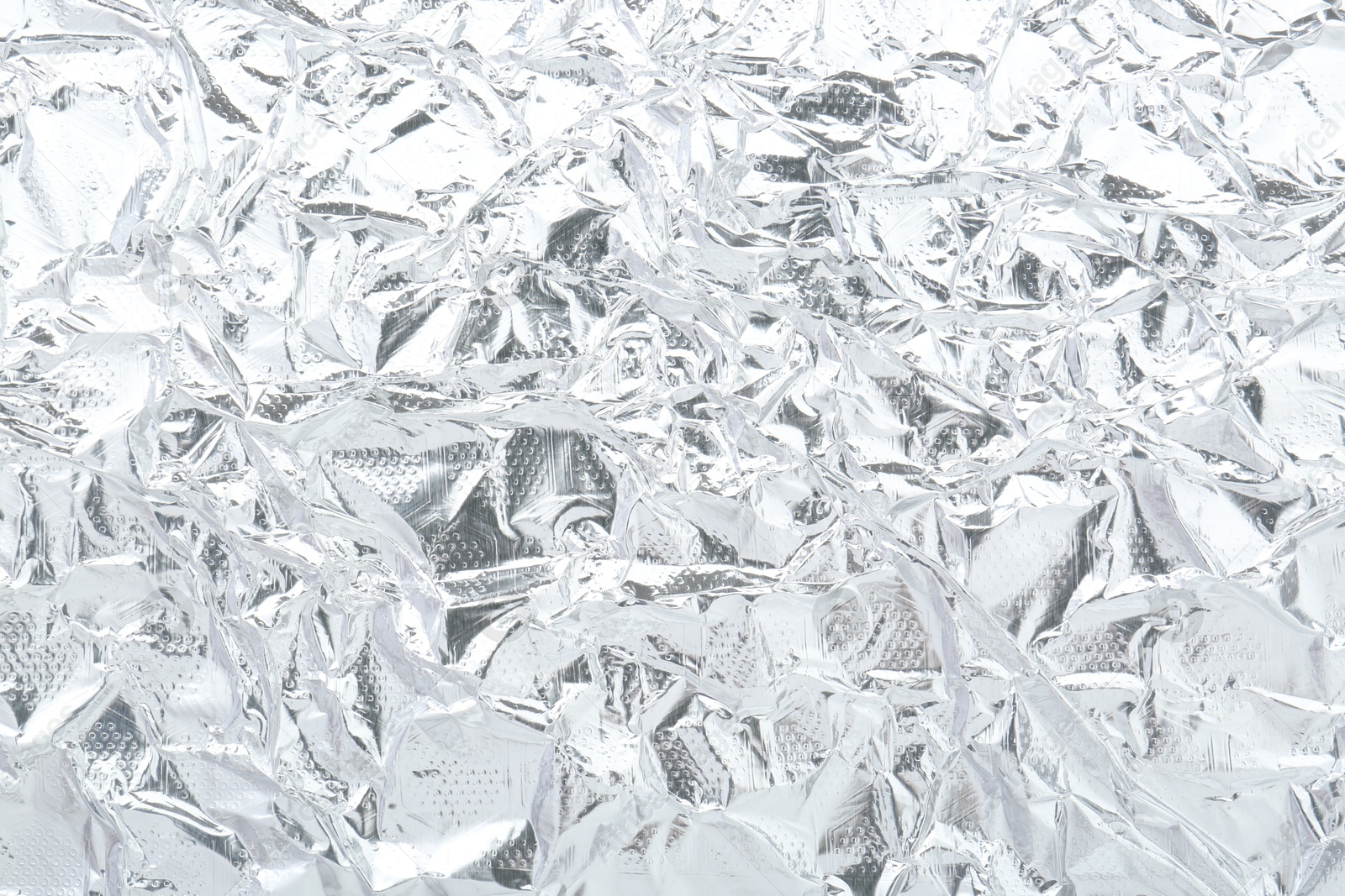 Photo of Shiny silver tinfoil surface as background, top view