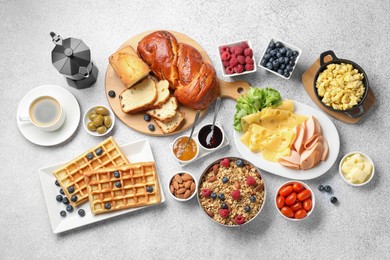 Photo of Tasty breakfast. Flat lay composition with many different food and coffee on grey textured table