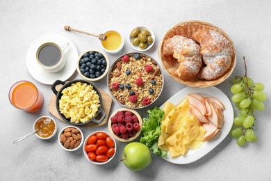 Photo of Tasty breakfast. Flat lay composition with many different food and drinks on grey textured table