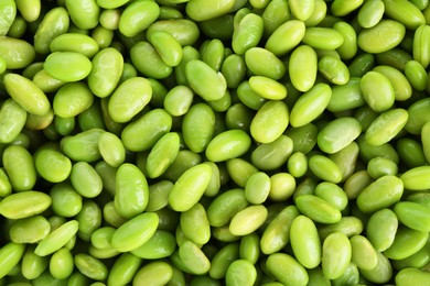 Photo of Raw green edamame soybeans as background, top view