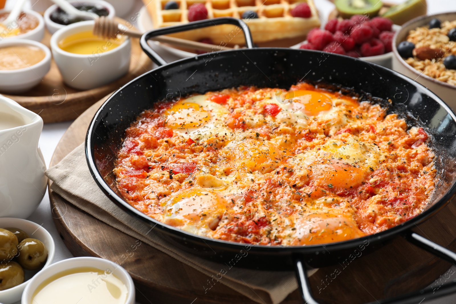 Photo of Different meals served for breakfast on white table, closeup