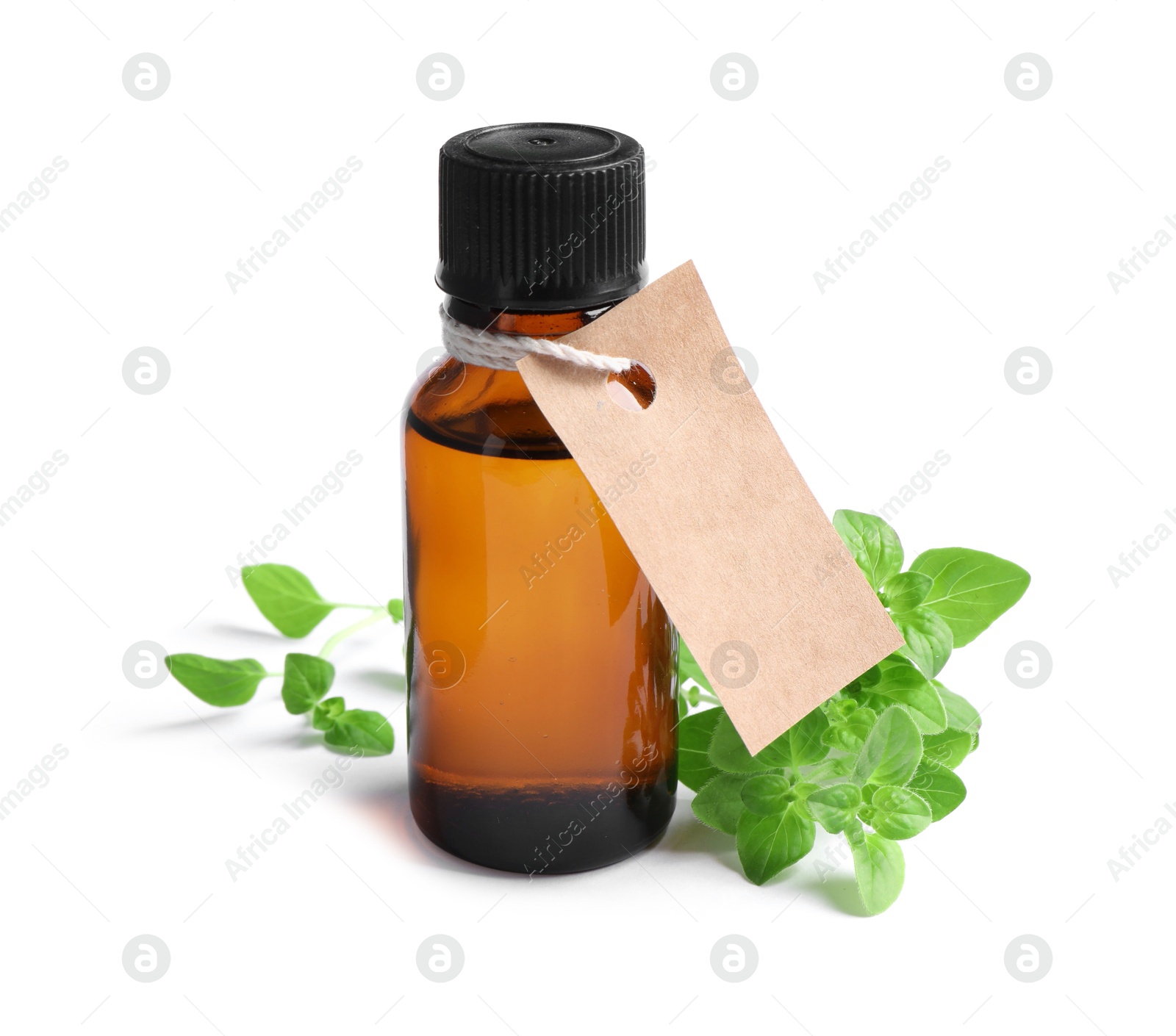 Photo of Essential oil in bottle with empty tag and oregano leaves isolated on white