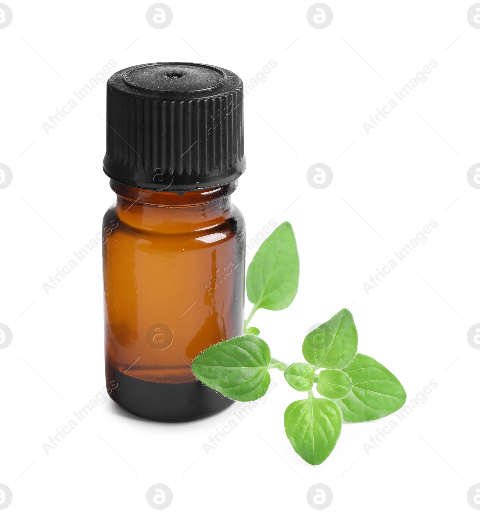 Photo of Essential oil in bottle and oregano leaves isolated on white