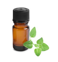 Photo of Essential oil in bottle and oregano leaves isolated on white