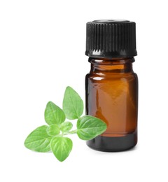 Photo of Essential oil in bottle and oregano leaves isolated on white