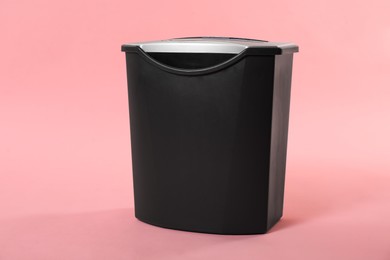 Photo of Paper shredder with basket on pink background