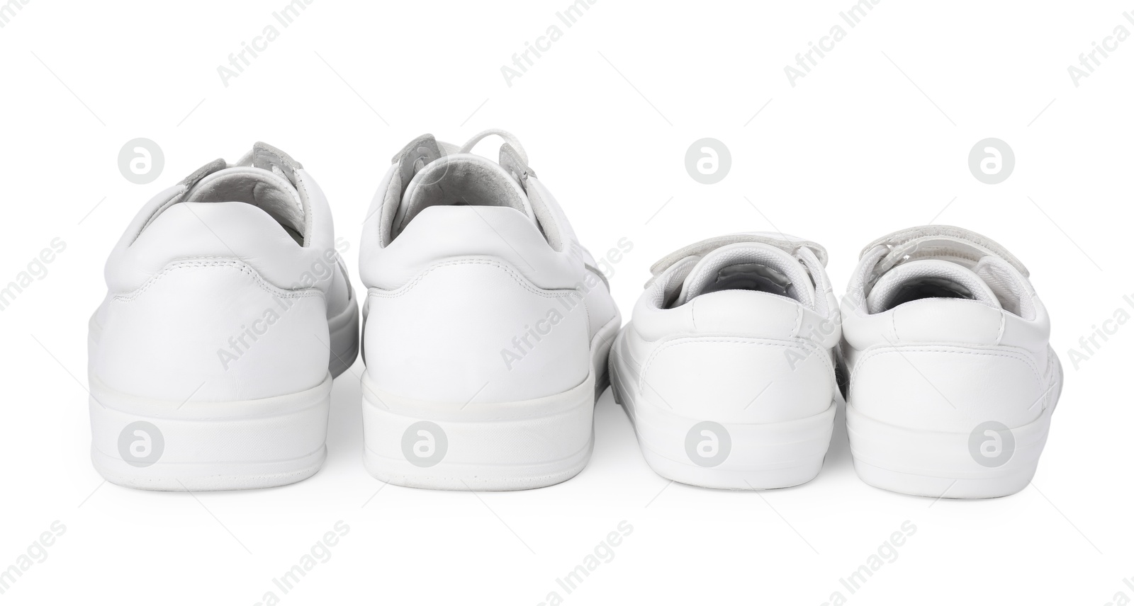 Photo of Big and small sneakers isolated on white