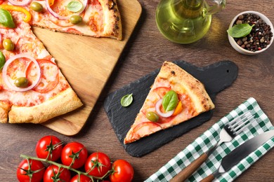 Photo of Delicious vegetarian pizza served on wooden table, flat lay