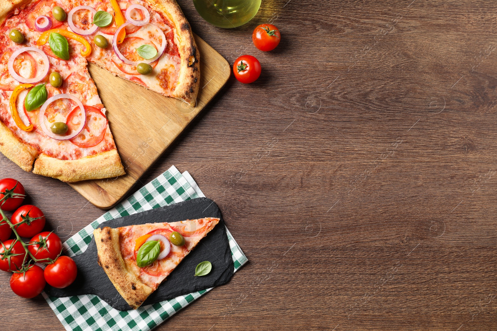 Photo of Delicious vegetarian pizza served on wooden table, flat lay. Space for text