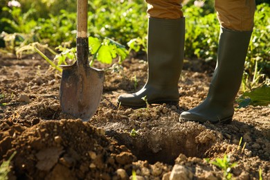 Farmer with shovel on sunny day, closeup