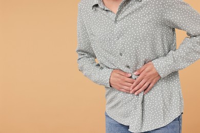 Indigestion problem. Woman suffering from stomachache, closeup