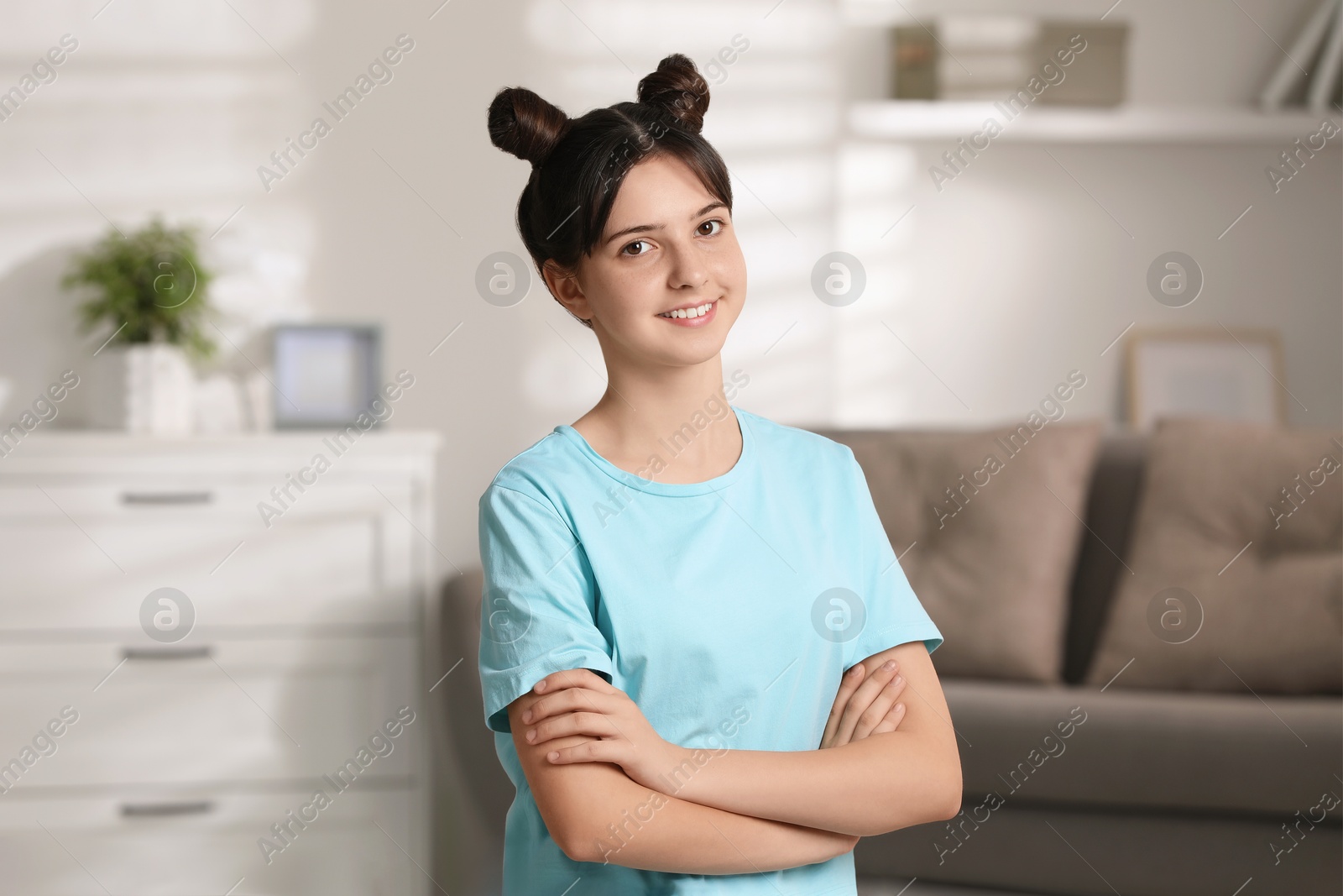 Photo of Portrait of smiling teenage girl at home