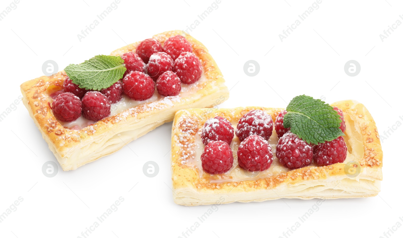 Photo of Tasty puff pastries with raspberries and mint isolated on white