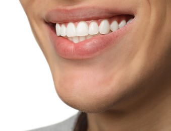 Happy young man on white background, closeup. Dental veneers