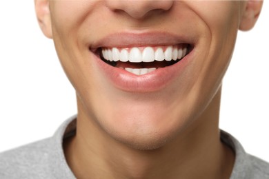 Happy young man on white background, closeup. Dental veneers