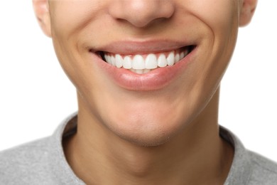 Photo of Happy young man on white background, closeup. Dental veneers