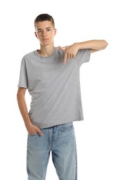 Photo of Teenage boy wearing grey t-shirt on white background