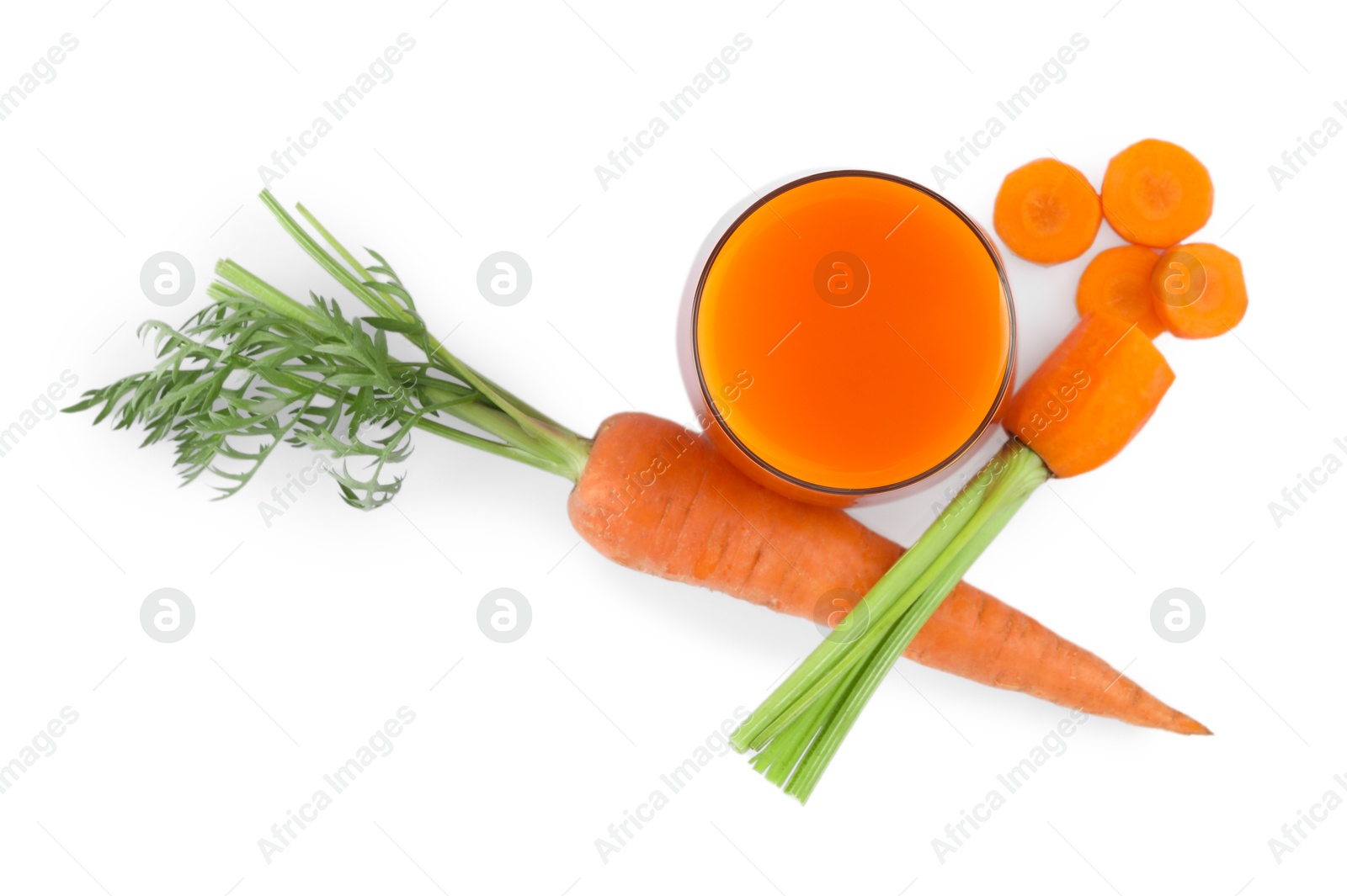 Photo of Healthy carrot juice in glass and fresh vegetables isolated on white, top view