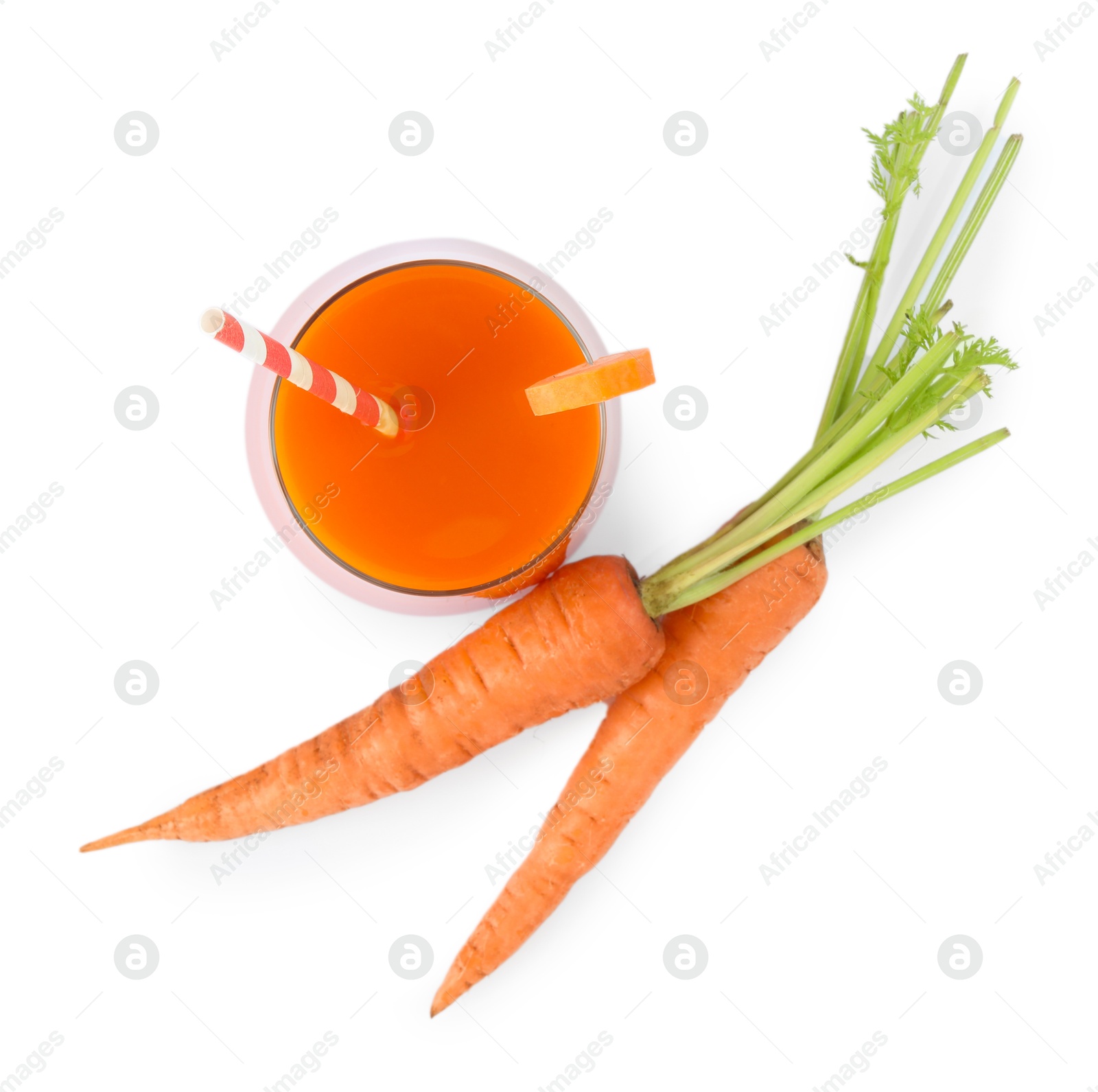 Photo of Healthy carrot juice in glass and fresh vegetables isolated on white, top view