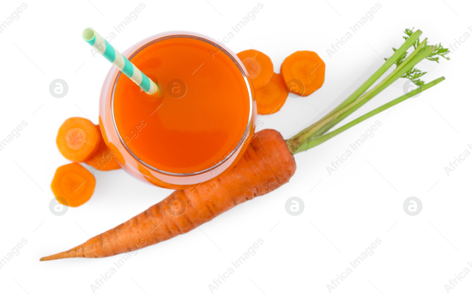 Photo of Healthy carrot juice in glass and fresh vegetables isolated on white, top view