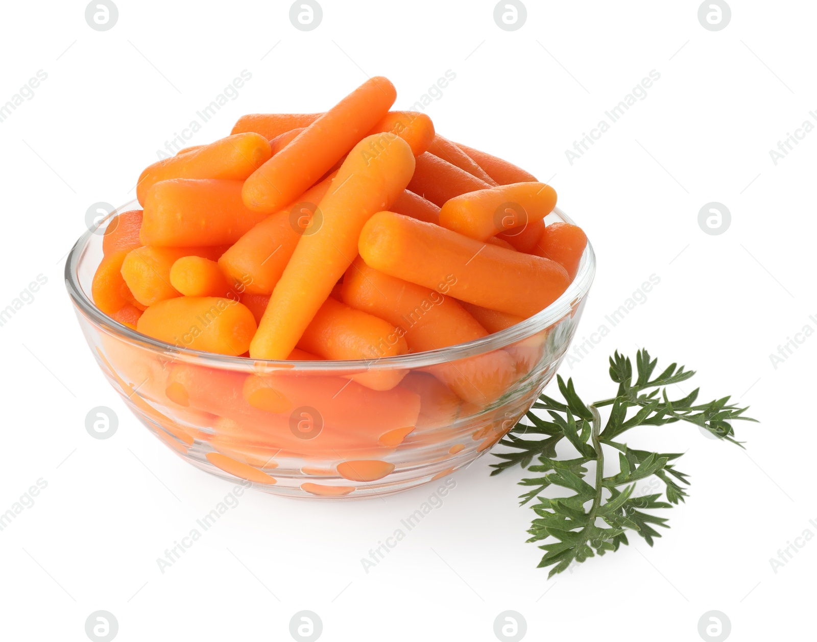 Photo of Baby carrots in bowl and green leaf isolated on white