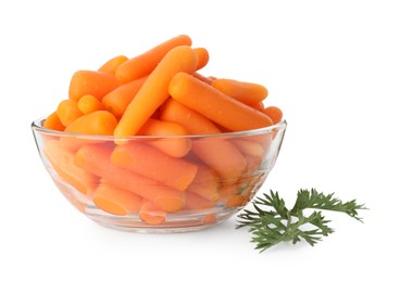 Photo of Baby carrots in bowl and green leaf isolated on white