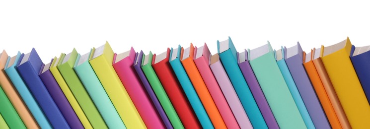 Many bright colorful books against white background