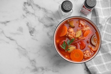 Photo of Tasty homemade stew with vegetables on white marble table, flat lay. Space for text